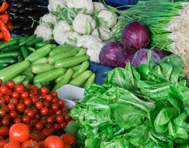 Fresh vegetables and fruits on a market stall.