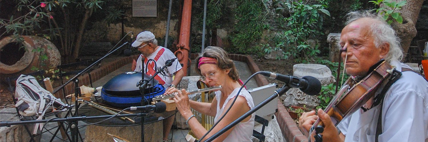 Three musicians playing their instruments at an event in Bodrum Castle.