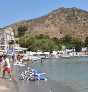 Visitors enjoying the summer weather in Bodrum at Akyarlar beach