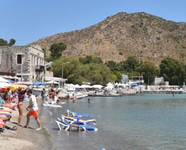 Visitors enjoying the summer weather in Bodrum at Akyarlar beach