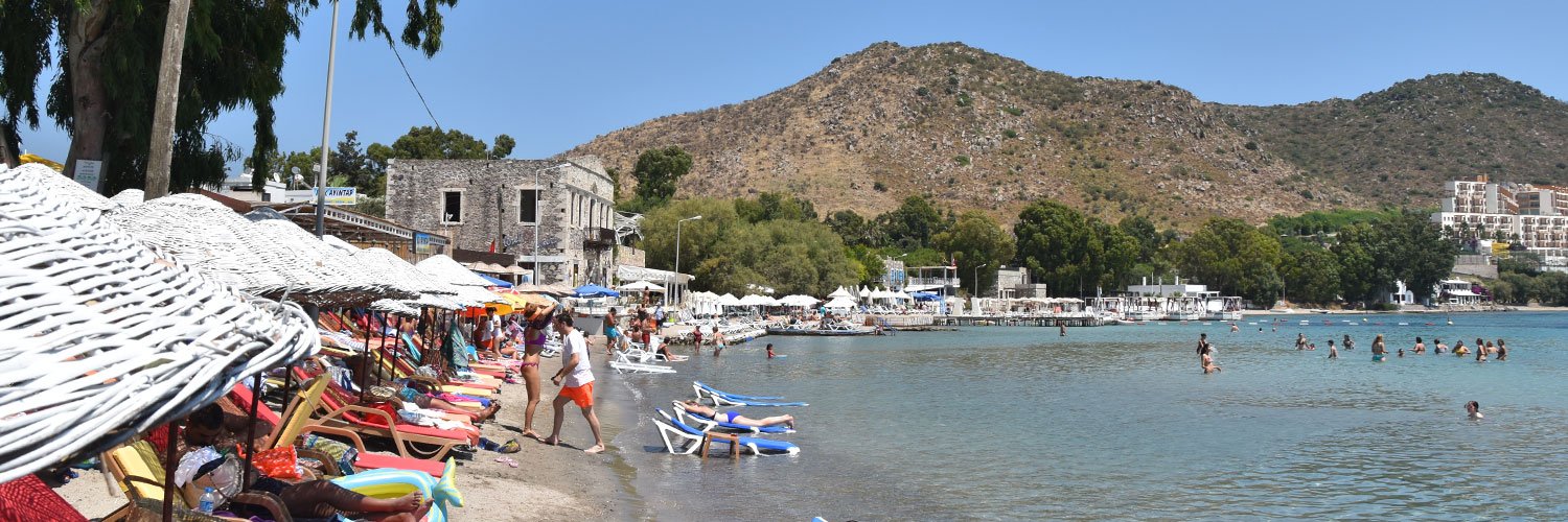 Visitors enjoying the summer weather in Bodrum at Akyarlar beach