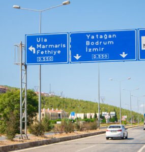 An expressway with traffic signs pointing Bodrum.