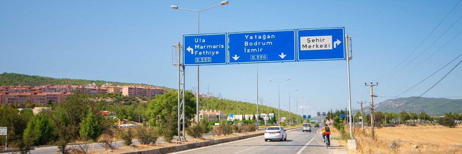 An expressway with traffic signs pointing Bodrum.