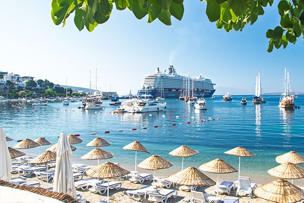 Sandy beach with sunbeds in Bodrum.
