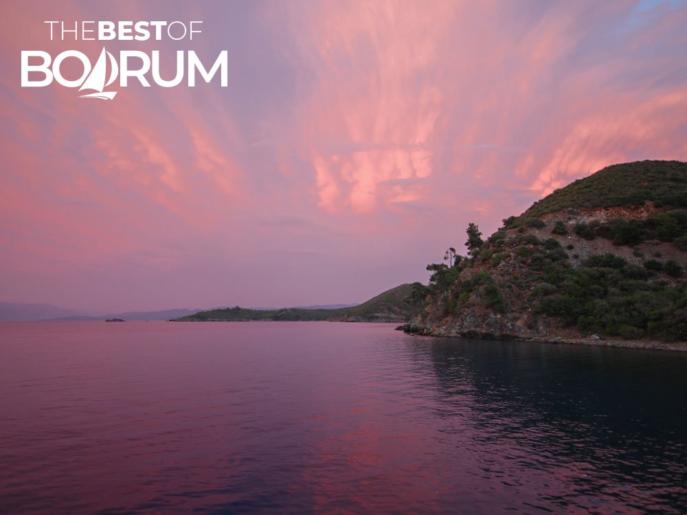 Soft pink sunset colours over the calm Aegean waters near Bodrum’s coastline.