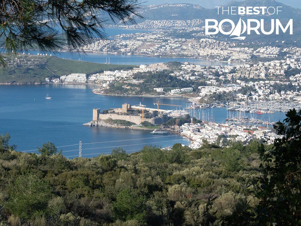 Wide view of Bodrum Turkey showing Bodrum Castle, Bodrum Bay, Gumbet Bay, and Bitez Bay from a hillside trail.