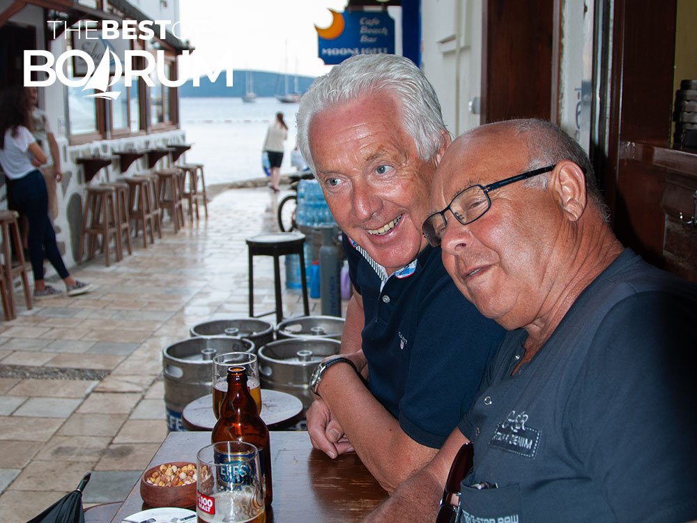 Two tourists enjoying drinks at a small bar on Bodrum’s Bar Street.