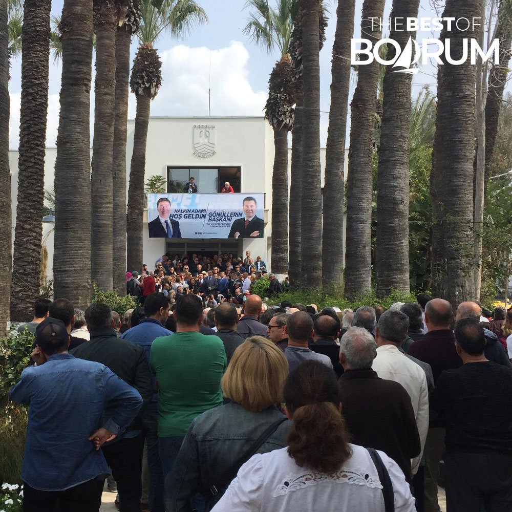 Crowd gathered in front of Bodrum Municipality as the newly elected mayor gives a speech.