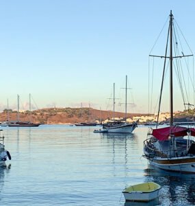 Boats anchored in the calm morning light during sunrise in Bodrum.