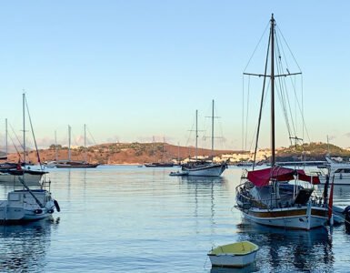 Boats anchored in the calm morning light during sunrise in Bodrum.